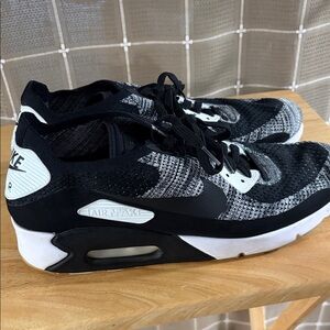 Nike Black and White Flyknit Air Max 90 Sneakers
